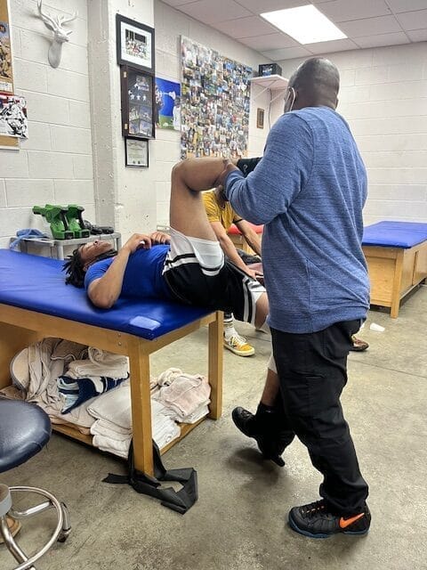 A therapist providing a consultation to a client in a well-lit room.