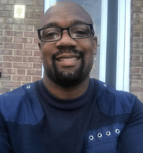 TyRonne Turner, a certified stretch therapist, smiling.